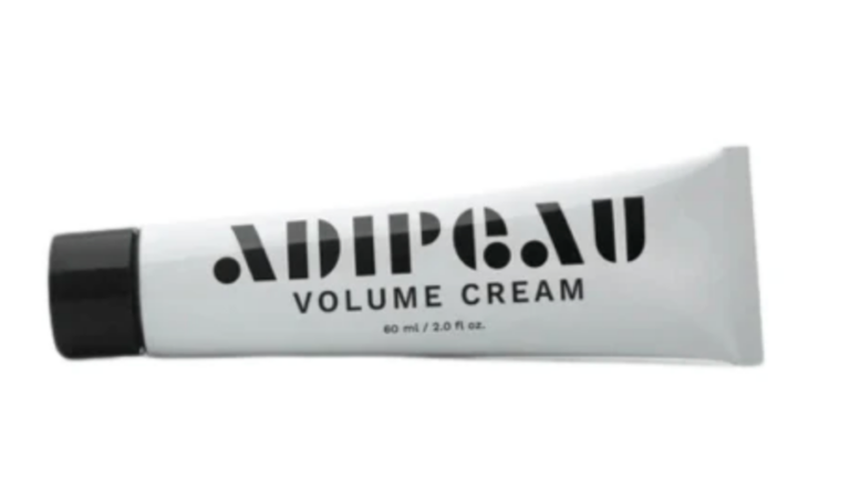 A white tube labeled ADIPEAU VOLUME CREAM with a black cap, inspired by the best of Los Angeles beauty.