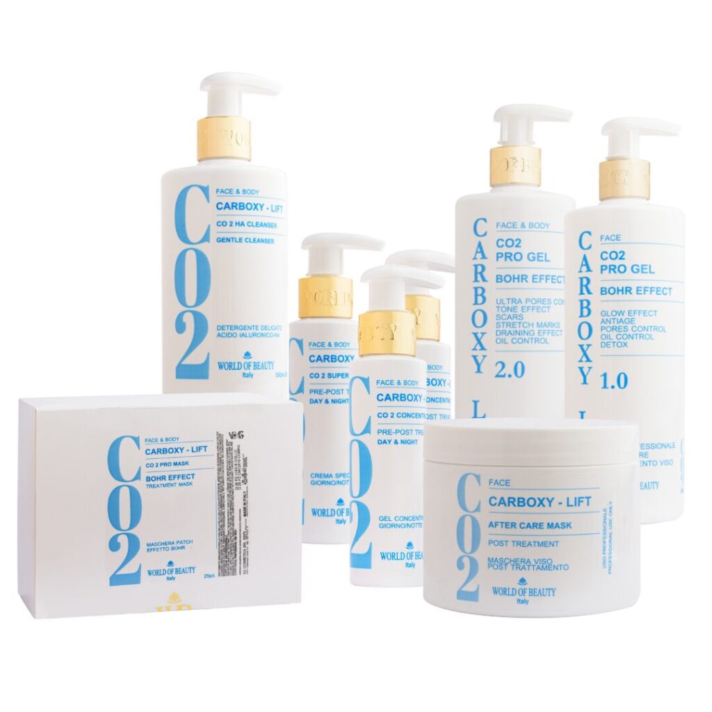 A set of Carboxy-Lift skincare products with white bottles and blue text, including cleansers, gels, and a box.